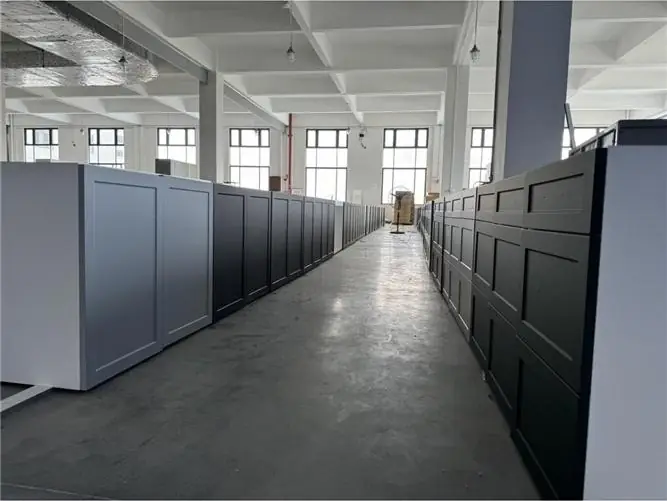 Painted shaker cabinets lined up in the partner factory