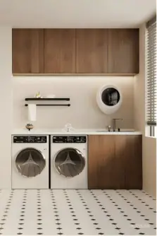 Laundry with walnut overheads and integrated washer and dryer