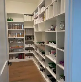 Walk-in pantry with adjustable open shelving